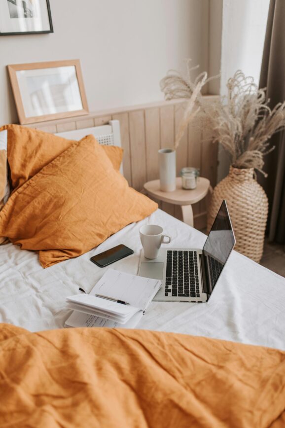 laptop on a bed